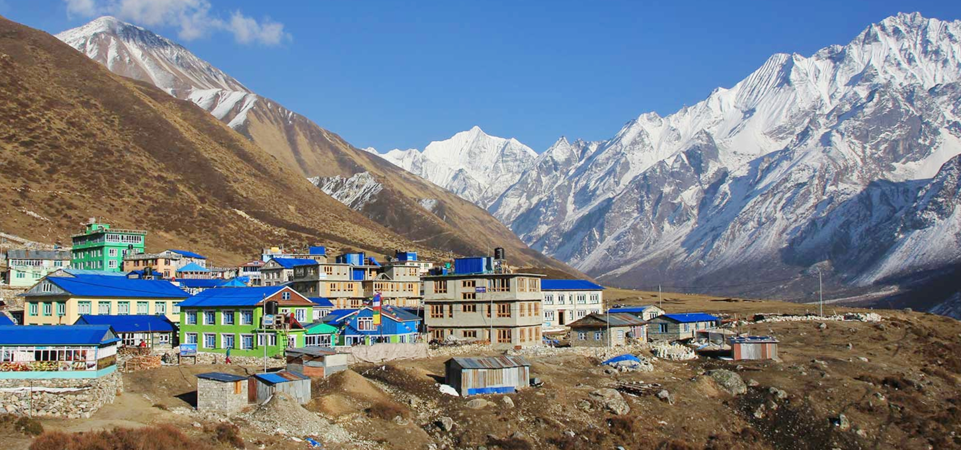 Langtang Valley with mountains scenario's in right side and homes in right side - Langtang Valley Trek with Hiking Himalayas Treks & Expedition