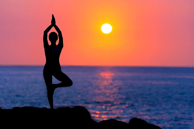 Meditation and yoga practice in Pokhara at sunset